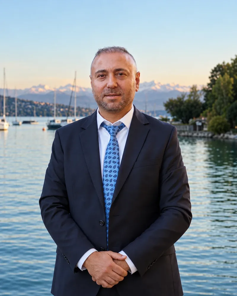Chauffeur Sadem in a dark suit and blue tie