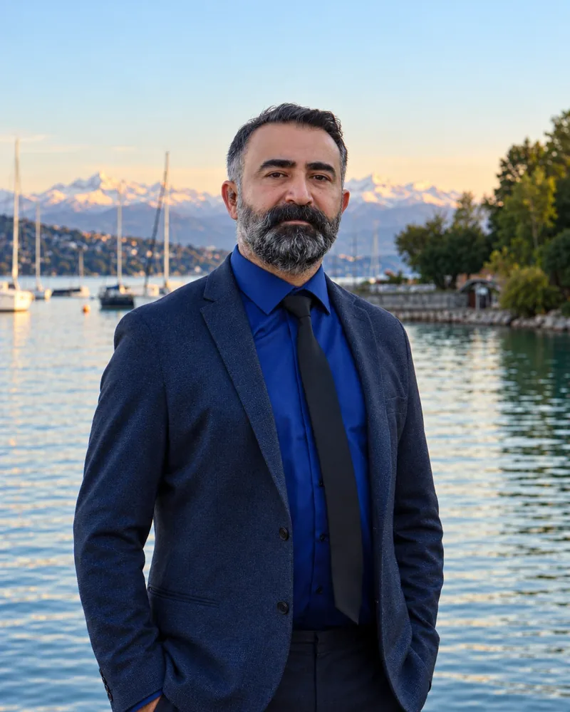 Chauffeur Sedat in a navy jacket and blue shirt