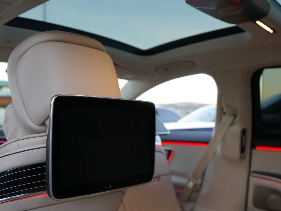 Rear cabin of a VIP Class sedan with beige seats